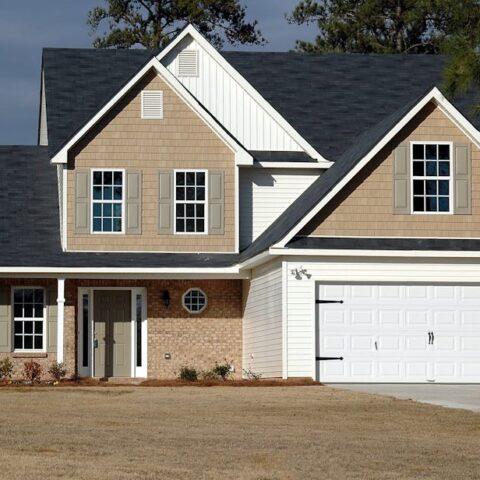 Elegant two-storey house with garage, showcasing modern architecture and residential charm.